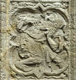 Panel 14:02 - Ape-headed man, twisting around and scratching his nose